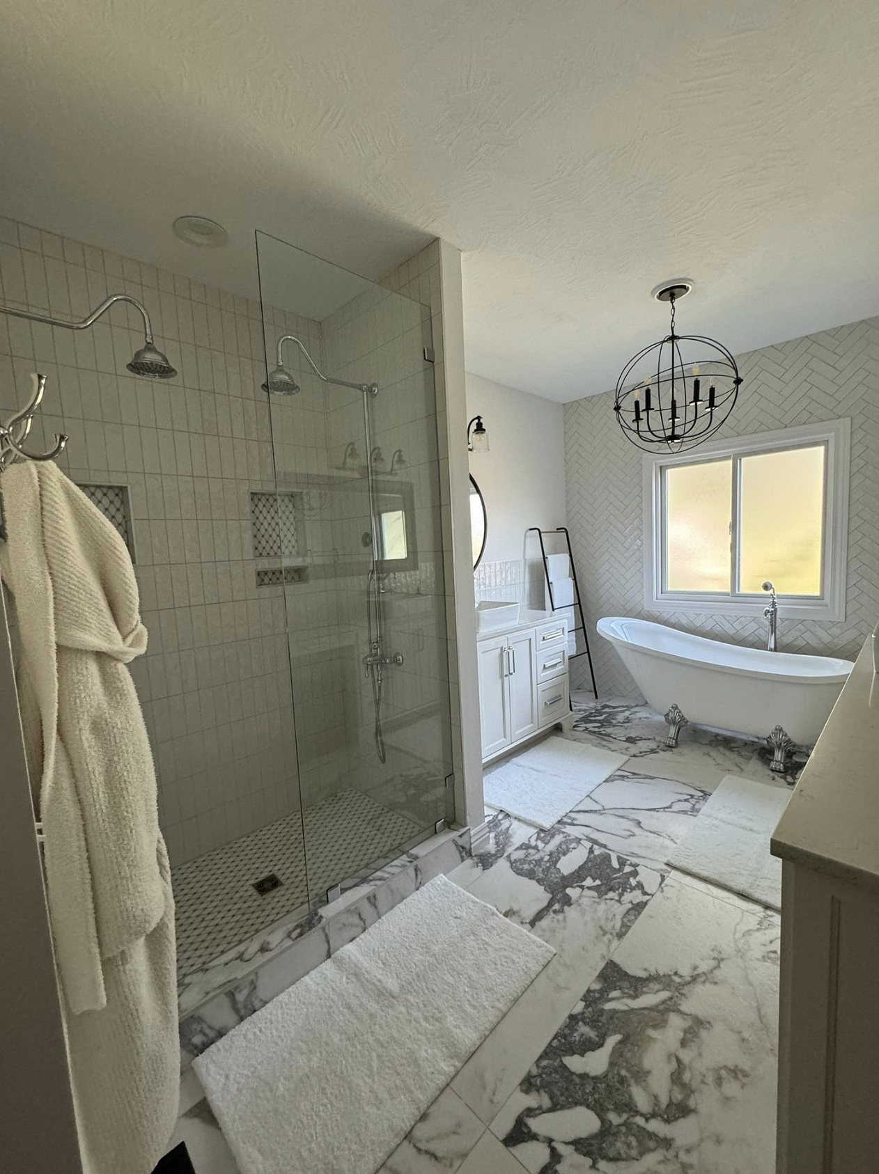 Renovated master bathroom with marble flooring after remodel in Springfield MO