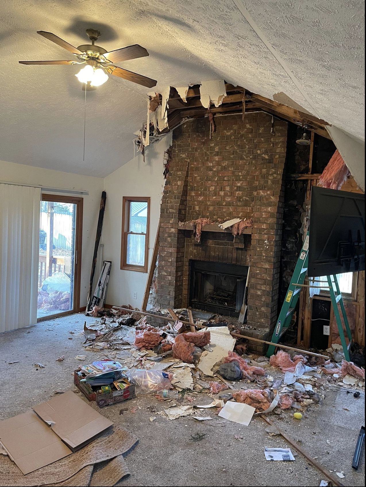 Living room with fire and smoke damage before restoration in Springfield MO